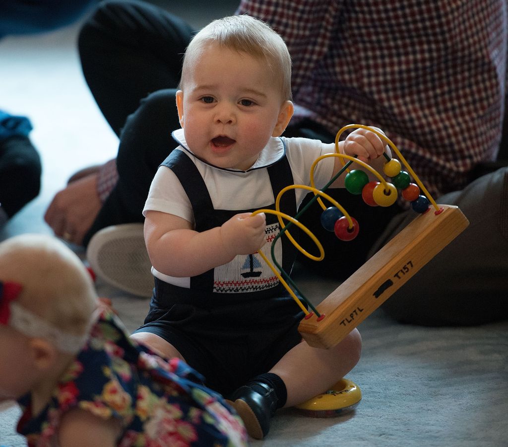 Baby Prince George playing with an abacus