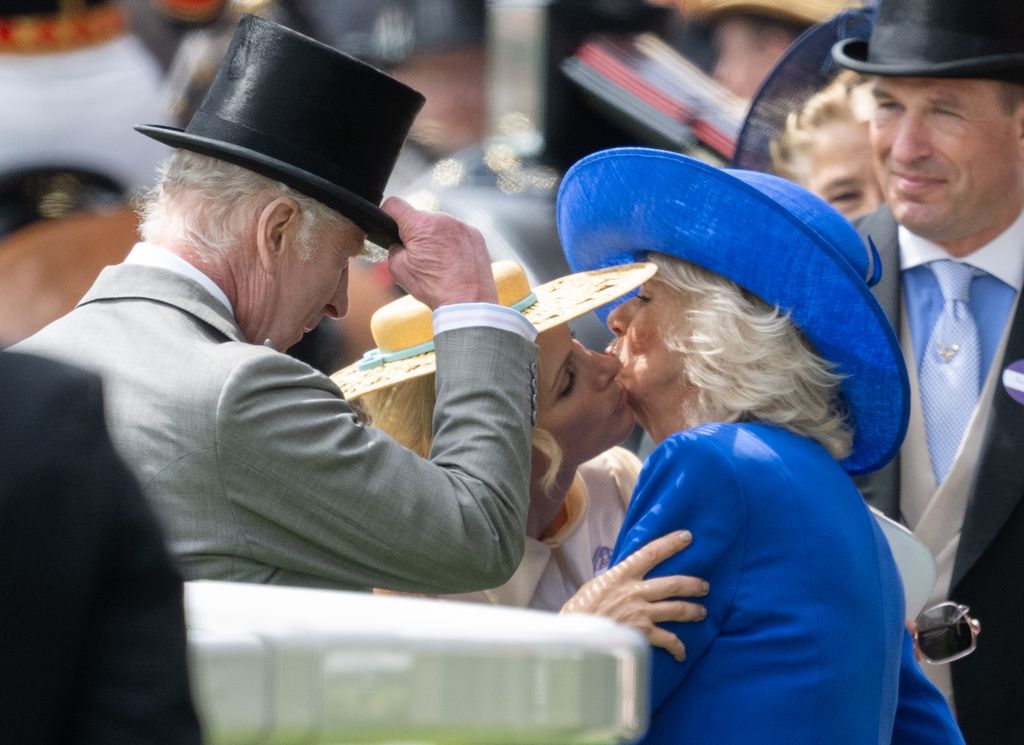 The royal family kissing at Ascot