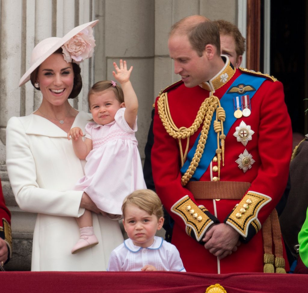 Princess Charlotte waves from the palace balcony