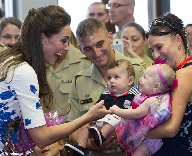 Meeting with families of service personnel at the Royal Australian Airforce Base at Amberley, Brisbane, in 2014, Kate was taken with baby twins Oscar and Alyssa McCabe
