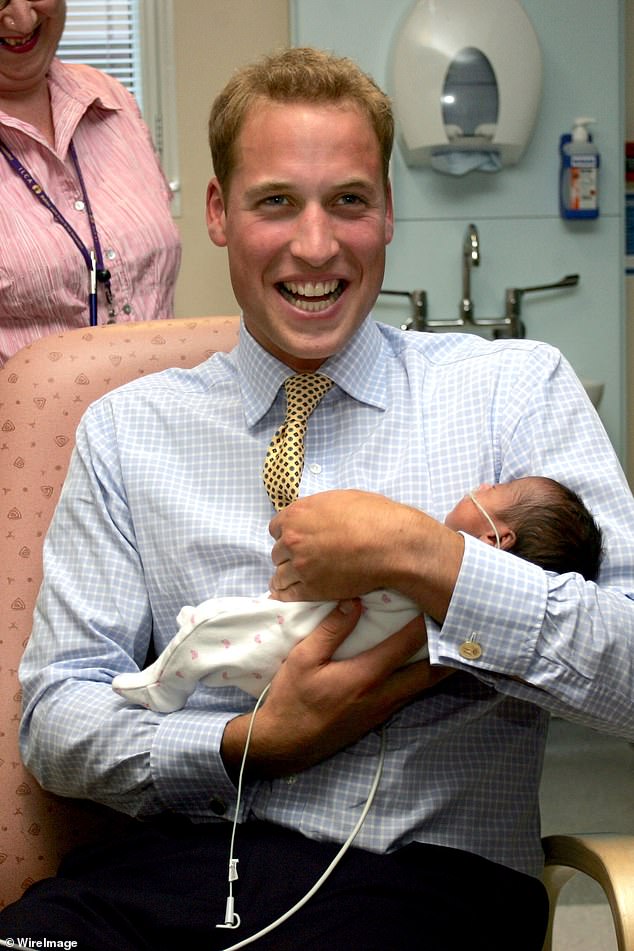 Prince William smiles as he hholds newborn baby Sina Nuru in the new Winnicott Baby Unit at St Mary's Hospital, Paddington in September 2006