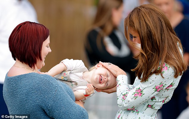 Mother-of-three Kate put her hands on 15-month-old Matilda’s head and playfully rubbed her hair as she attended the "Back to Nature" festival at RHS Garden Wisley in September 2019