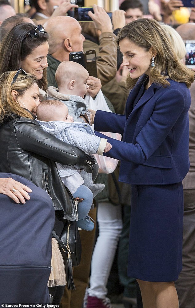 Queen Letizia of Spain showed off her maternal side while visiting Valencia's central market when she took a moment to greet passersby and cooed over a baby in November 2016