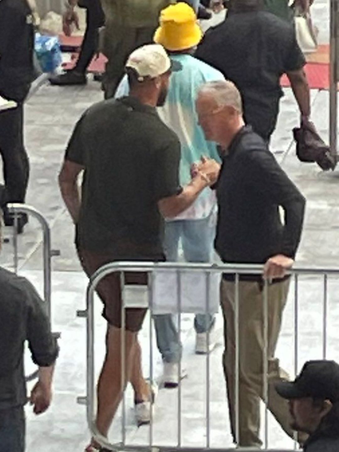 Travis Kelce walks past security guards