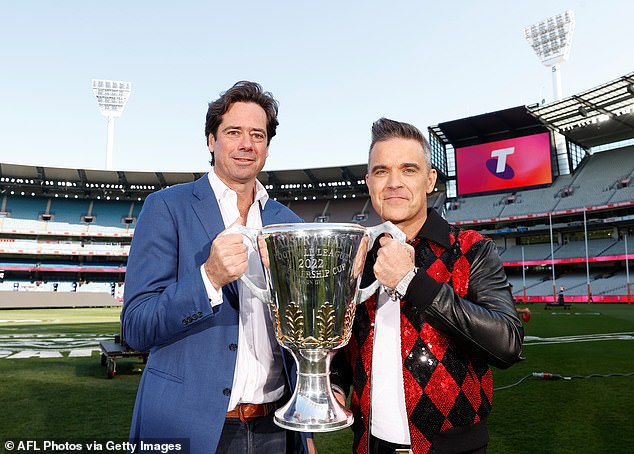 The former Take That star (pictured with former AFL CEO Gillon McLachlan) has kept a close eye on the Blues since their stunning performance in the 2022 Grand Final