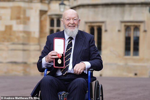 Eavis (pictured) smiling after receiving his knighthood to services to music and charity