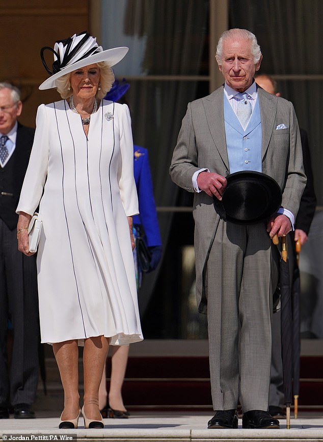 King Charles III and Queen Camilla listened to the national anthem at Buckingham Palace today