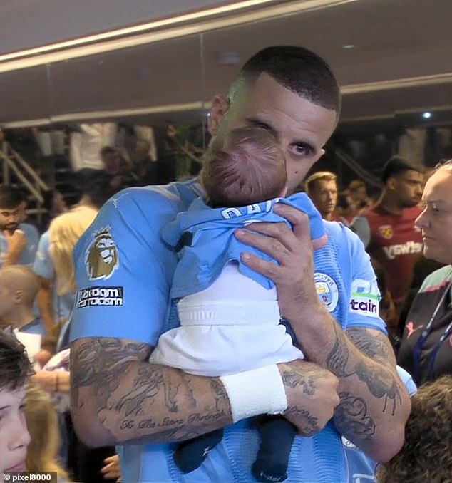 The footballer kissed his son before stepping onto the football field last month
