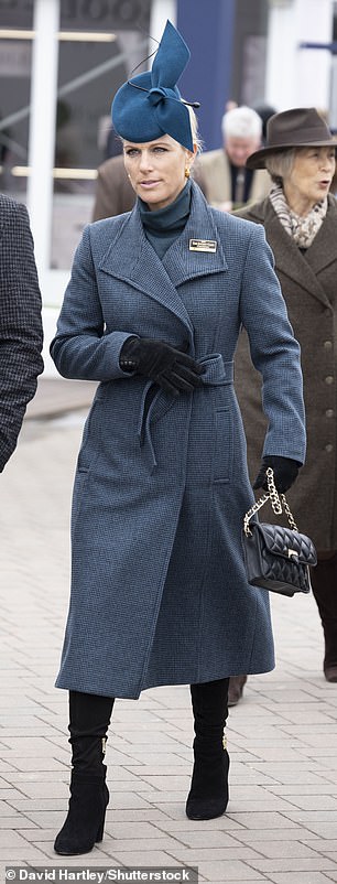 Zara looked warm and stylish in this teal Rebecca Valance wrap coat