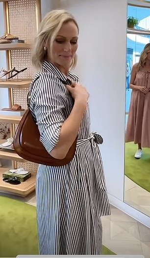 Six months later at Pacific Fair Shopping Centre in Australia she wore it with a different Aspinal of London crossbody bag and a pair of white trainers