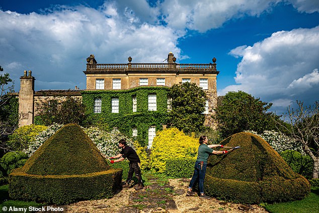 Gardeners tend to topiary bushes at the private residence of King Charles III and Queen Camilla in the gardens of Highgrove, Gloucestershire, ahead of World Topiary Day on May 12