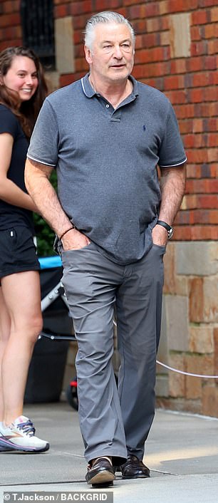 Alec Baldwin, 66, looks in high spirits during errand run with wife Hilaria, 40, in NYC – as it’s confirmed he WILL go to trial for fatal Rust shooting