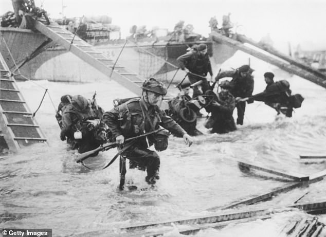 Troops from the 48th Royal Marines at Saint-Aubin-sur-mer on Juno Beach, Normandy, France, during the D-Day landings, June 6, 1944