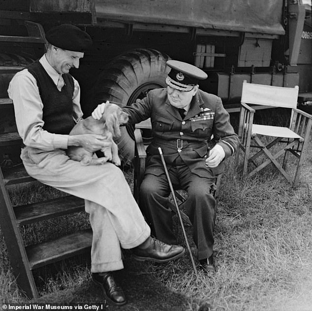 Winston Churchill strokes General Montgomery's dog Rommel during a visit to Normandy, August 7, 1944
