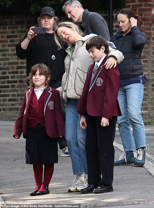 while his young co-stars playing his daughter Mabel and son Billy wore school uniforms