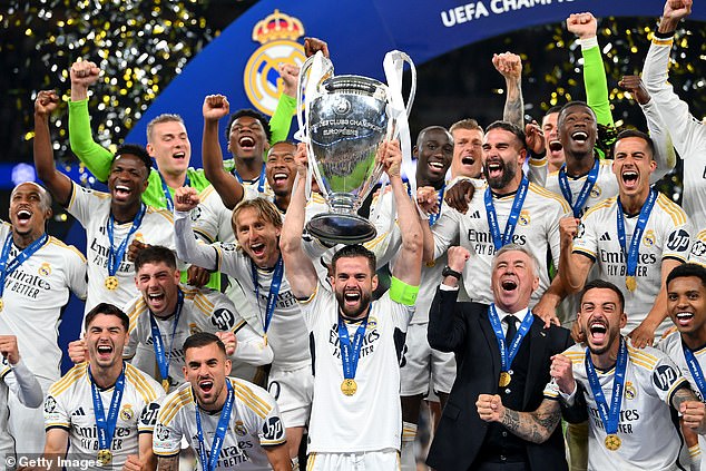 Nacho Fernandez lifts Real Madrid's 15th Champions League trophy. They have not lost a European Cup final since 1981