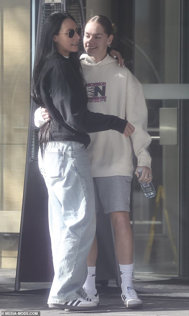 Matildas star Sharna Freier, 22, (right) was spotted packing on the PDA with girlfriend Jessica Righetti (left) on Sunday morning as they went for a walk around their hotel.