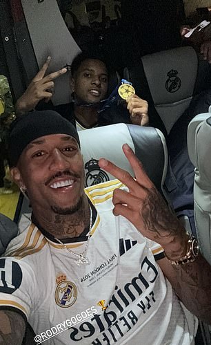 Militao (left) replaced Rodrygo (right) in injury time and the two posed for a photo on the team bus after the match