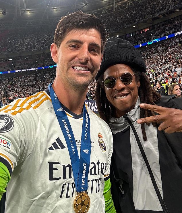 Jay Z (right) was also seen on the pitch at full time with Thibaut Courtois (left)
