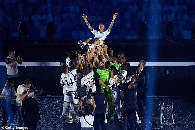 The players hoisted midfielder Toni Kroos (above) into the air as he played his final match for the club