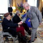 King Charles and Queen Camilla hear poignant tales of courage from D-Day veterans: Heroes share memories and treasured keepsakes during visit to Buckingham Palace for 80th anniversary commemorations