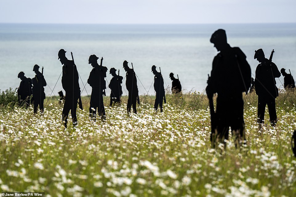 The memorial features 1,475 silhouettes across the wild meadow fields of the British Normandy Memorial
