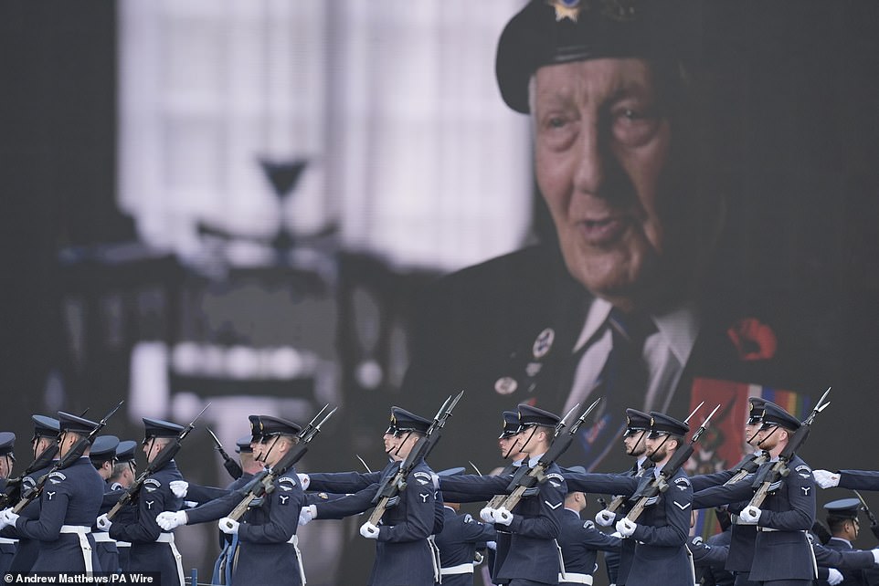 Members of the military on stage during the UK's national commemorative event