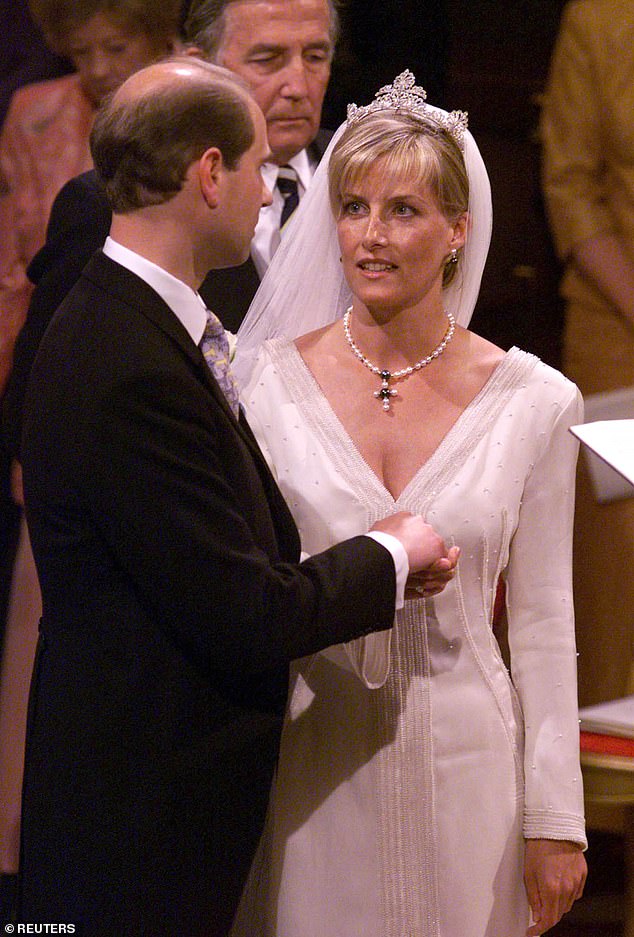 25 years ago today, Prince Edward holds the hand of his bride Sophie on their wedding day at St George's Chapel in Windsor