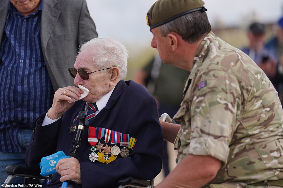 Veteran Donald Jones reacts as he returns to Sword Beach in Normandy