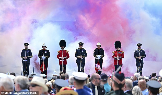 Members of the current armed forces in ceremonial uniform paying tribute to D-Day veterans in Portsmouth