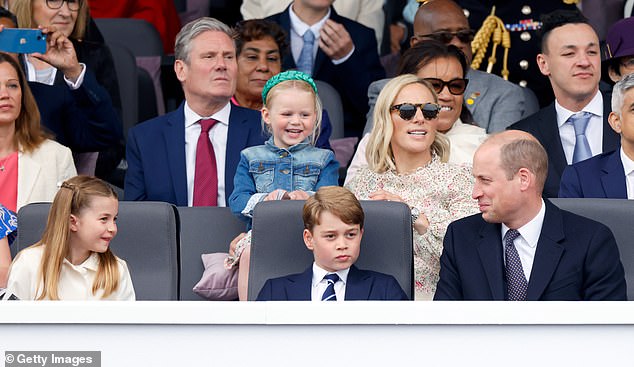 Lena sits next to her mother Zara Tindall at the Platinum Jubilee Pageant at The Mall in 2022, while Prince William sits in front with his eldest children Prince George and Princess Charlotte
