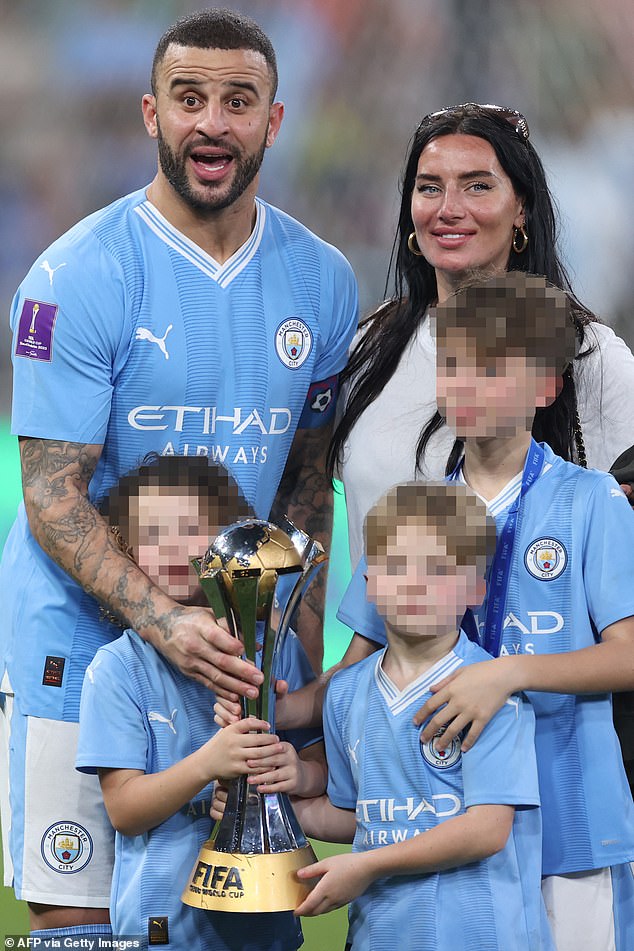 Walker posing with his family and the trophy after the FIFA Club World Cup Final in December 2023