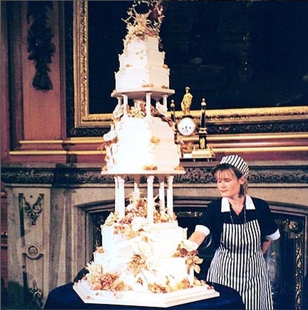 Linda Fripp shows off a ten-foot-high fondant cake that took her over 515 hours to make