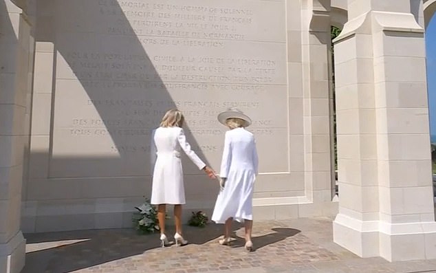 Awkward moment Brigitte Macron tries to hold hands with Queen Camilla at D-Day memorial – after French president kept the royals waiting by arriving late
