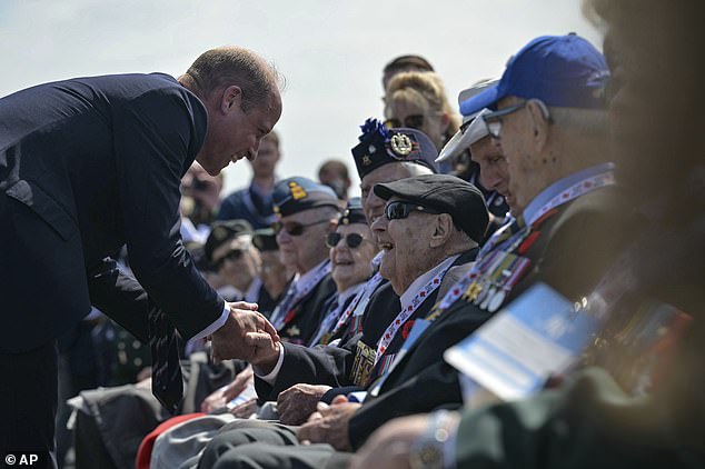 The Prince of Wales shakes the hand of a Canadian veteran at Juno Beach in northern France on the 80th anniversary of D-Day