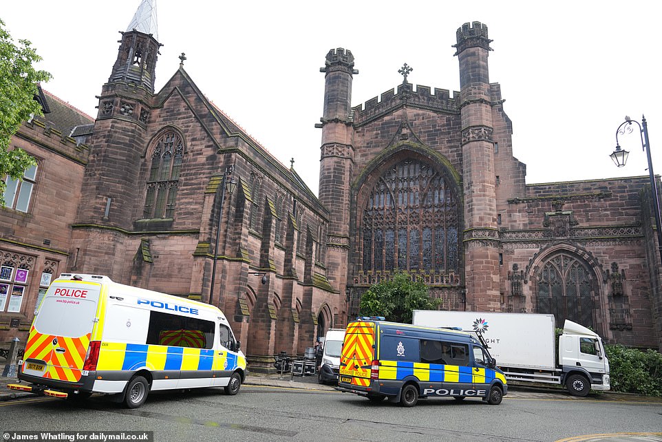 Police vans in Chester Cathedral, where the wedding ceremony will take place