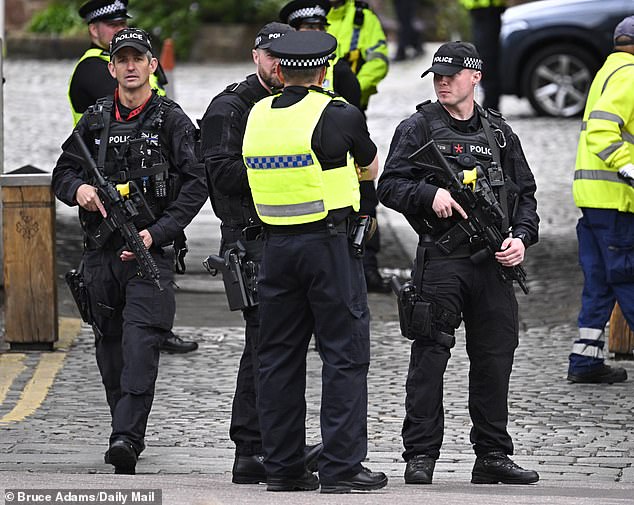 Police officers outside the cathedral in Cheshire today ahead of the ceremony