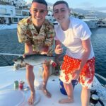 Catch of the Day! Phil Foden proves he’s a reel winner by landing huge fish on yacht during family holiday in Marbella before he joins up with fellow England stars ahead of Euro 2024