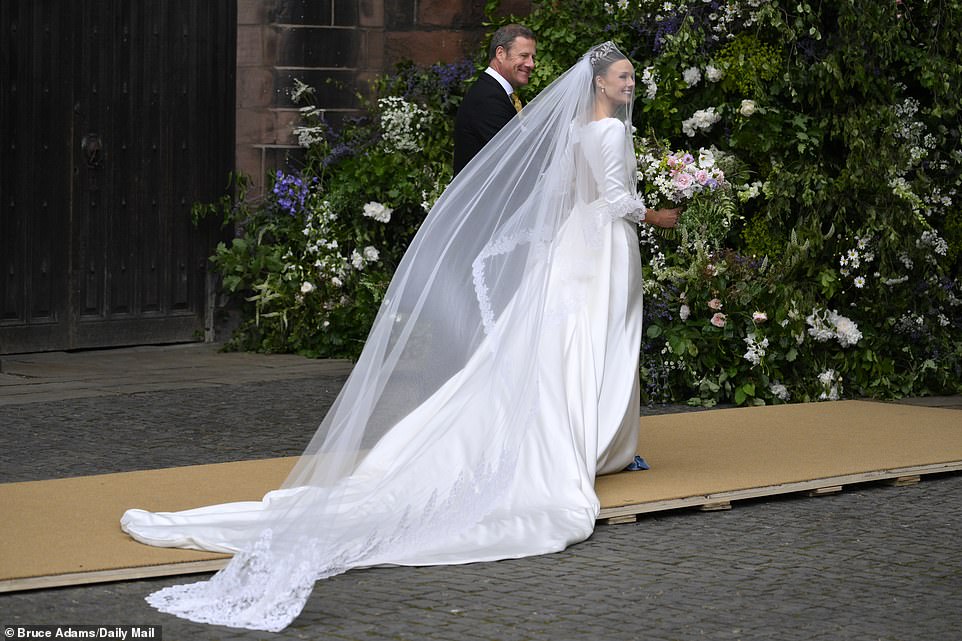 Olivia Henson in her wedding dress outside the Cathedral for her wedding to Hugh Grosvenor