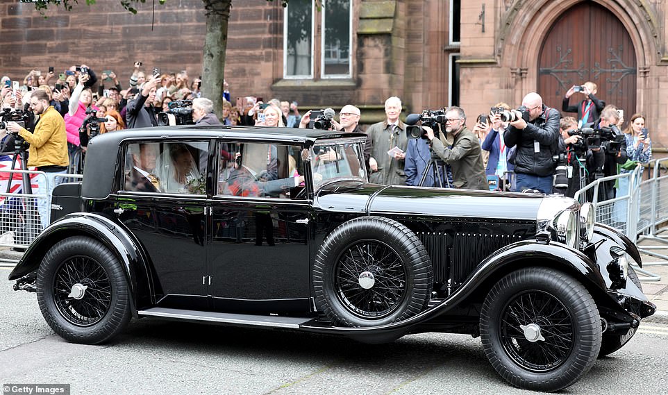 Olivia Henson arrives vin a vintage Bentley for her wedding to Hugh Grosvenor, Duke of Westminster