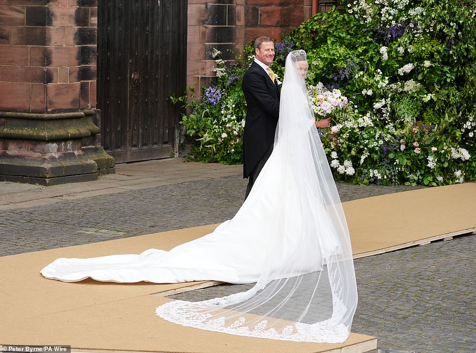The bespoke embroidery design on her gown and veil was hand drawn by Emma Victoria Payne