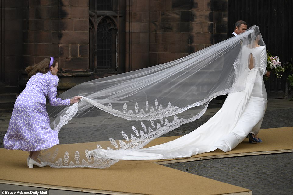 The bride wore blue shoes with her wedding dress to marry the Duke of Westminster