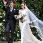 Olivia Henson is a bridal beauty in Emma Victoria Payne gown containing a nod to her ancestors and a tiara from the Duke of Westminster’s family vault as she seals her marriage with a kiss for the crowds