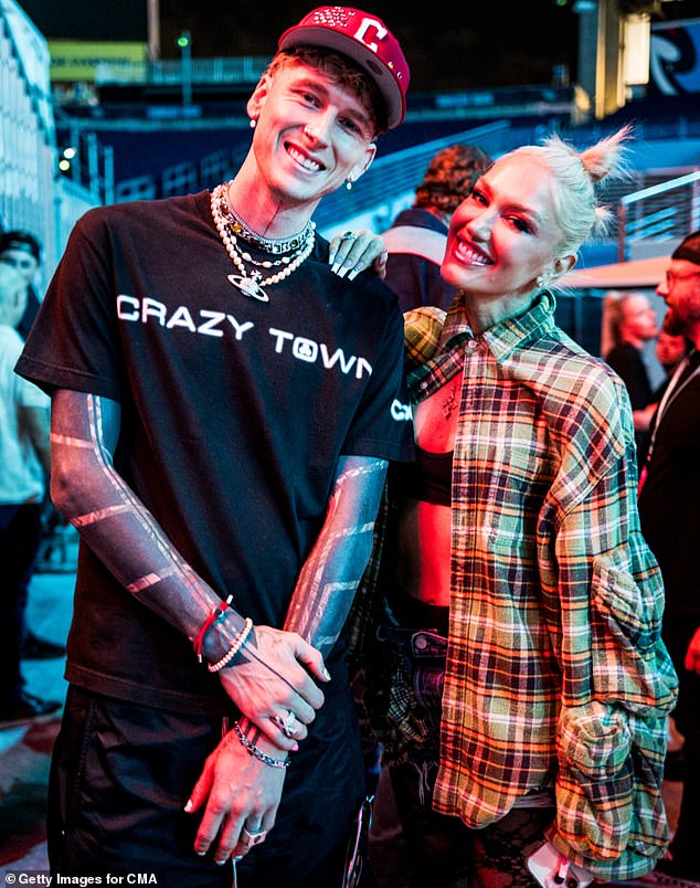 MGK, whose birth name was Colson Baker, wore a black 'Crazy Town' T-shirt and a red hat