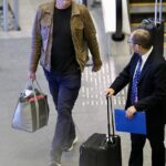 Hollywood actor Vince Vaughn rocks a leather jacket as he goes souvenir shopping at Brisbane Airport before flying to LA after hosting business conference