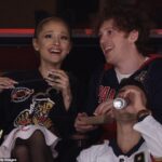 Ariana Grande laughs with Wicked boyfriend Ethan Slater at game one of Stanley Cup Final… after she released video for her song The Boy Is Mine rumored to be about him