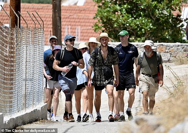 Young British volunteers, friends of the family walk the pathway towards Agua Marina near Pedi on Friday as they searched for Dr Mosley