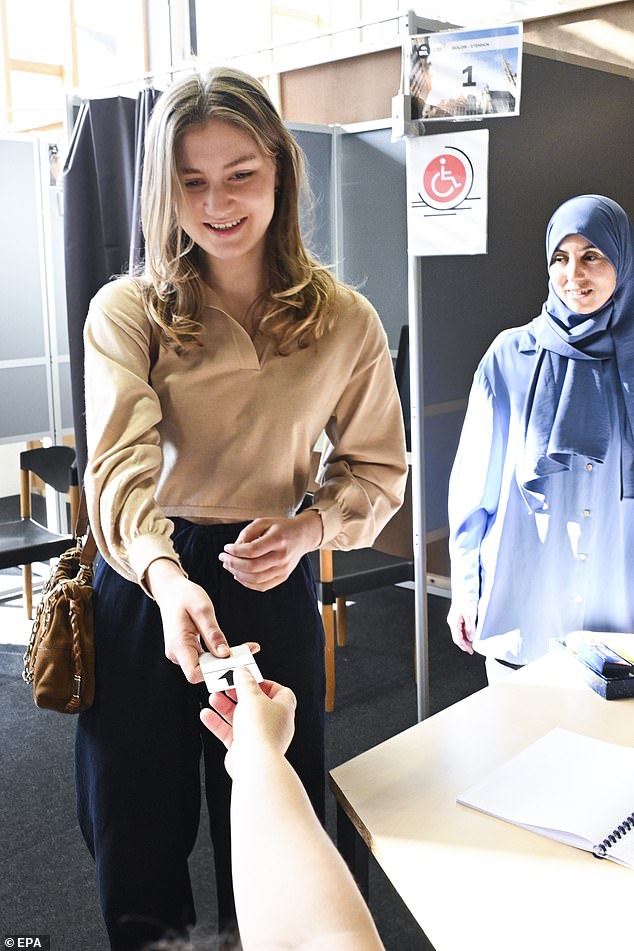 She smiled as she interacted with election officials inside the polling booth