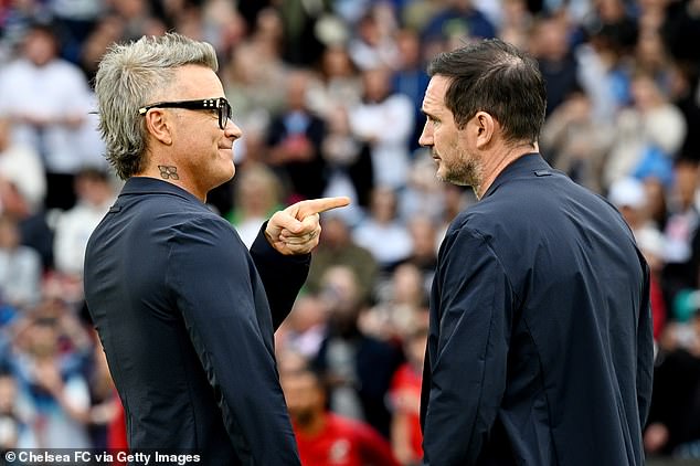 The singer was seen having an intense conversation with Frank, 45, ahead of the star-studded match