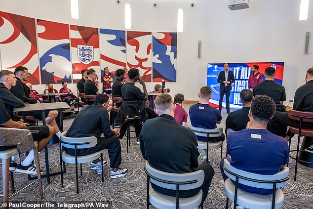 The Prince of Wales addresses players and staff during a visit to St George's Park today